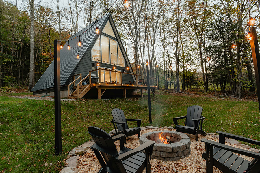 A remote cabin with a fire pit.