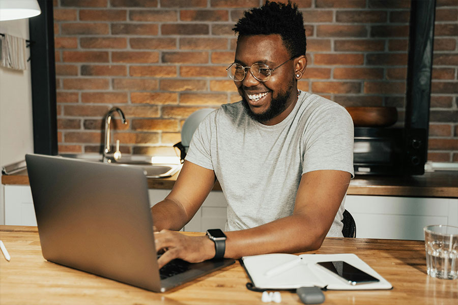 A man using a laptop at home.