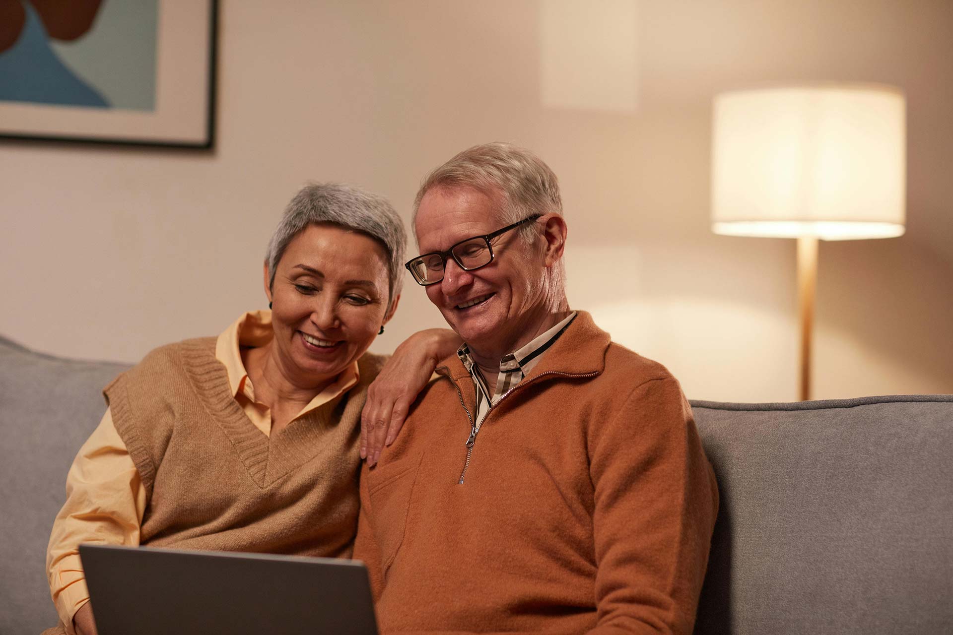 A couple watching a laptop computer with 5G internet