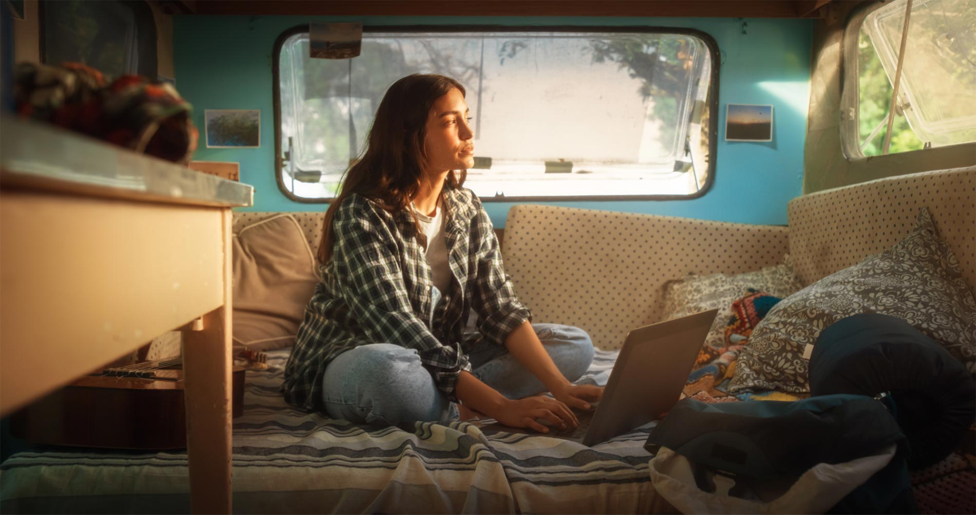 woman on a laptop in a camper with portable wireless internet