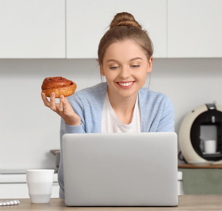 woman on a laptop in her kitchen with 5g internet